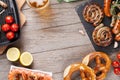 Beer mug, grilled shrimps, sausages and pretzel Royalty Free Stock Photo