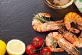 Beer mug and grilled shrimps on stone plate Royalty Free Stock Photo