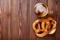 Beer mug and pretzel on wooden table Royalty Free Stock Photo
