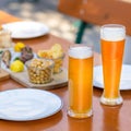 Beer mugs, glasses with snacks Royalty Free Stock Photo