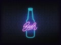 Beer neon glowing sign. Bright vector label of beer bottle and lettering