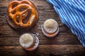 Beer and Oktoberfest. Draft beer pretzel and blue checkered tablecloth as traditional products for bavarian festival oktoberfest Royalty Free Stock Photo