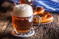 Beer and Oktoberfest. Draft beer pretzel and blue checkered tablecloth as traditional products for bavarian festival oktoberfest Royalty Free Stock Photo