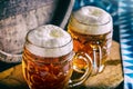 Beer. Oktoberfest.Two cold beers. Draft beer. Draft ale. Golden beer. Golden ale. Two gold beer with froth on top. Draft cold beer Royalty Free Stock Photo