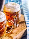 Beer. Oktoberfest.Two cold beers. Draft beer. Draft ale. Golden beer. Golden ale. Two gold beer with froth on top. Draft cold beer Royalty Free Stock Photo