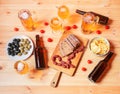 Beer, olives, potato chips, bread and little chorizo sausages on wooden table. Top view Royalty Free Stock Photo