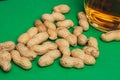 beer peanuts in shells bar alcohol green background Royalty Free Stock Photo