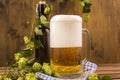 Beer. Pint of Beer close up on a wooden background. Cold Craft light Beer in a glass with water drops. Beer is pouring Royalty Free Stock Photo