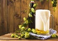 Beer. Pint of Beer close up on a wooden background. Cold Craft light Beer in a glass with water drops. Beer is pouring Royalty Free Stock Photo