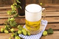 Beer. Pint of Beer close up on a wooden background. Cold Craft light Beer in a glass with water drops. Beer is pouring Royalty Free Stock Photo