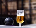 Beer in plastic beaker and bowling ball at sports event Royalty Free Stock Photo