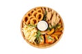 Beer plate fried ribs onion rings french fries fish nuggets on a wooden plate on a white background4