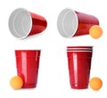 Beer pong. Set with red plastic cups and balls on white background Royalty Free Stock Photo