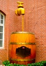Beer poured into a big beer barrel