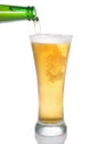 Beer pouring from bottle into glass Royalty Free Stock Photo