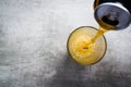 Beer pouring out of a can into a glass Royalty Free Stock Photo