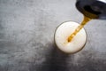 Beer pouring out of a can into a glass Royalty Free Stock Photo