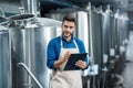 Beer production process, brewing at brewery. Plant management to make craft alcohol Royalty Free Stock Photo