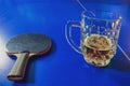 Beer and racket on the tennis table, sports and alcohol