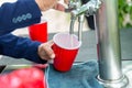 Beer in red cup. Red Plastic Drinking Cups. Plastic red solo drinking cups for beer pong or drinking game. Royalty Free Stock Photo