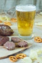 Beer, sausages, pretzels and chips. Octoberfest theme