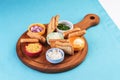 Beer set with onion rings, bread toasts and sauces according to the Mediterranean recipe Royalty Free Stock Photo