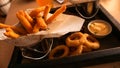 Beer set of snacks on a wooden tray. Snack for friends in a brasserie Royalty Free Stock Photo