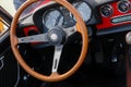 Vintage Alfa Romeo car interior - steering wheel dashboard and gear shift Royalty Free Stock Photo