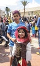 Beer-Sheva, ISRAEL - March 5, 2015: Boy and girl in oriental costume on the street in the crowd at the festival of Purim Royalty Free Stock Photo