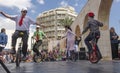 Beer-Sheva, ISRAEL - March 5, 2015:Boys and girls performed on bicycles with one wheel on the street scene - Purim Royalty Free Stock Photo