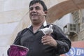 Beer-Sheva, ISRAEL - March 5, 2015: A magician in a black shirt with a microphone and a white dove -Purim