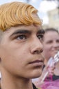 Beer-Sheva, ISRAEL - March 5, 2015: Portrait of a boy teenager with bushy black eyebrows and dyed dark yellow hair -Purim