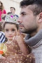 Beer-Sheva, ISRAEL - March 5, 2015: Portrait of father and daughter - with dark hair girl - in the crown and gown - Purim