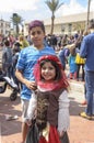 Beer-Sheva, ISRAEL - March 5, 2015: Teenager boy with purple hair dyed in a blue striped shirt with girl -Purim Royalty Free Stock Photo