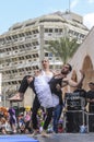 Beer-Sheva, ISRAEL - March 5, 2015: Two men, clowns, gymnasts, one of them in a tutu on the open stage - Purim Royalty Free Stock Photo