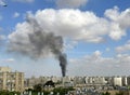A column of smoke at the site of a fallen Hamas rocket