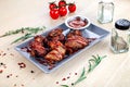 Close up view on Chicken wings deep-fried with ketchup on white table. Royalty Free Stock Photo