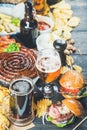 Beer and snack set on dark wooden scorched background Royalty Free Stock Photo