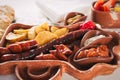 Beer and snack set. Variety of beers, grilled sausages, fried potatoes, salted on wooden background