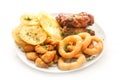 Beer snack: spicy chicken wings  cheese balls  fried black bread toast with garlic  onion rings in batter. Snack on a white Royalty Free Stock Photo