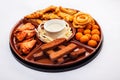 Beer snack: spicy chicken wings  cheese balls  fried black bread toast with garlic  onion rings in batter. Snack on a white Royalty Free Stock Photo