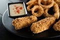 Beer snacks. Breaded meat appetizer and onion rings Royalty Free Stock Photo