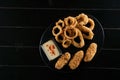 Beer snacks. Breaded meat appetizer and onion rings Royalty Free Stock Photo