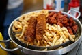 Beer snacks. French fries, chicken wings, grilled, potato chips Royalty Free Stock Photo