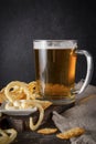 Beer with snacks ,  glass of light beer with onion rings and sauce Royalty Free Stock Photo