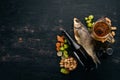 Beer and snacks. Salted crackers, Dried Fish, Chips, Nuts, Peanuts, Pistachios. On a white wooden background.