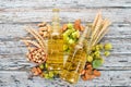 Beer and snacks. Salted crackers, Dried Fish, Chips, Nuts, Peanuts, Pistachios. On a white wooden background. Royalty Free Stock Photo