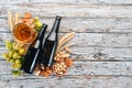 Beer and snacks. Salted crackers, Dried Fish, Chips, Nuts, Peanuts, Pistachios. On a white wooden background. Royalty Free Stock Photo