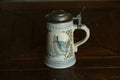 Beer stein with fish painted on side Royalty Free Stock Photo