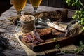 Beer still life with fishes and bottles. Meat basturma. October fest. Oktoberfest. Dry fish and dry meat. Country meal Royalty Free Stock Photo